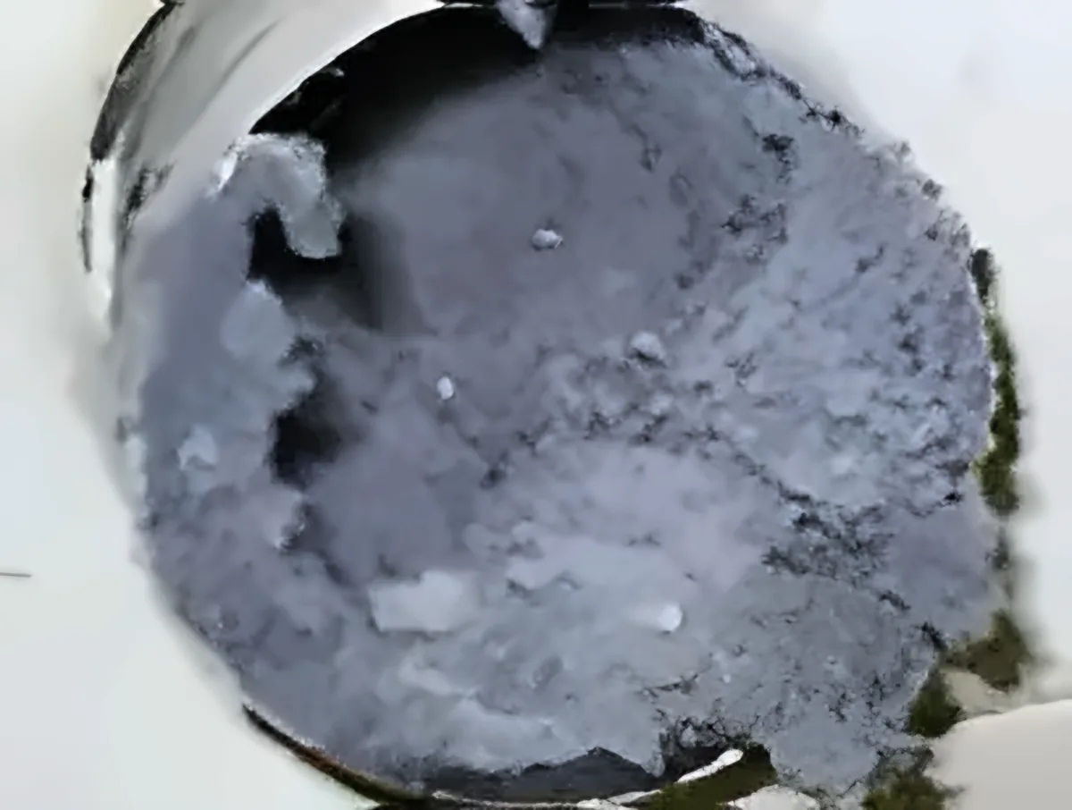 Dryer vent duct packed with lint before cleaning